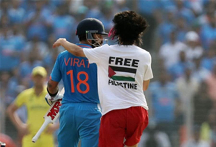 Pitch invader wearing 'Free Palestine' T-shirt hugs Kohli